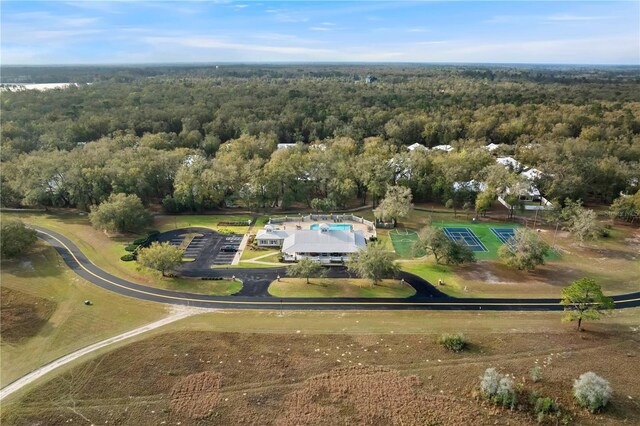 birds eye view of property featuring a wooded view