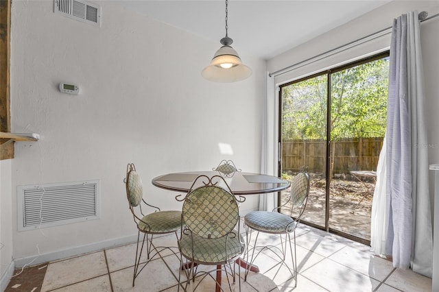 dining area featuring baseboards and visible vents