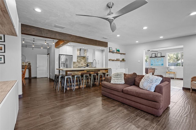 living area featuring recessed lighting, a ceiling fan, visible vents, and dark wood-style flooring