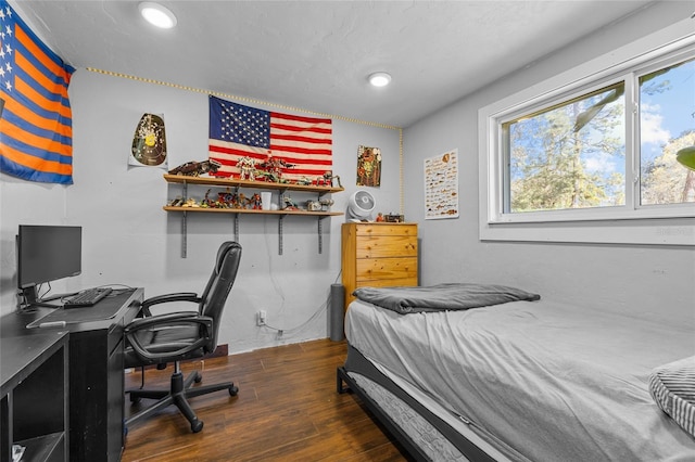 bedroom featuring recessed lighting and wood finished floors