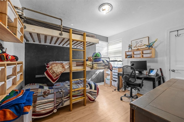 bedroom featuring wood finished floors