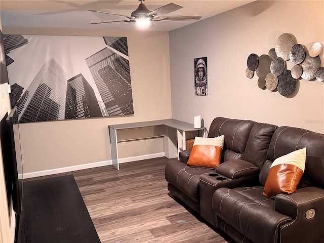 living area with wood finished floors, baseboards, and ceiling fan