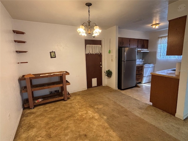 kitchen with decorative light fixtures, freestanding refrigerator, white range with electric stovetop, dark brown cabinetry, and light colored carpet