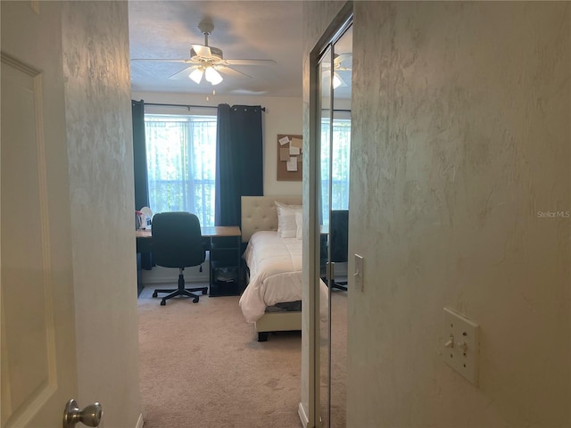 carpeted bedroom featuring ceiling fan