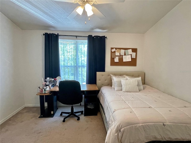 bedroom featuring baseboards, ceiling fan, and carpet flooring