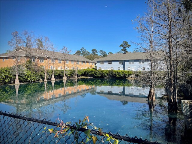 view of water feature with fence