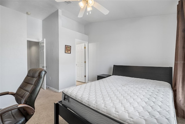 bedroom with baseboards, light carpet, ceiling fan, and vaulted ceiling