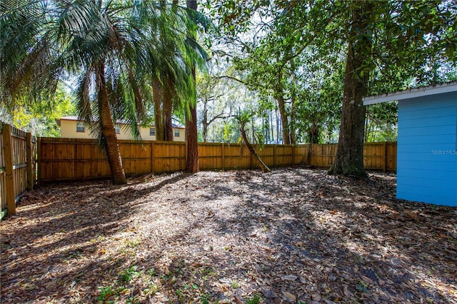 view of yard with a fenced backyard