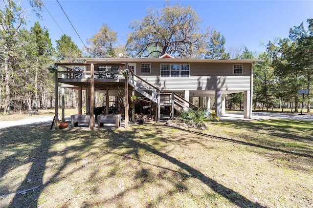 back of house with stairs and a wooden deck