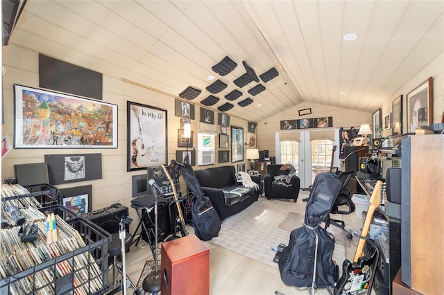 office space featuring wood walls, wood ceiling, vaulted ceiling, french doors, and wood finished floors