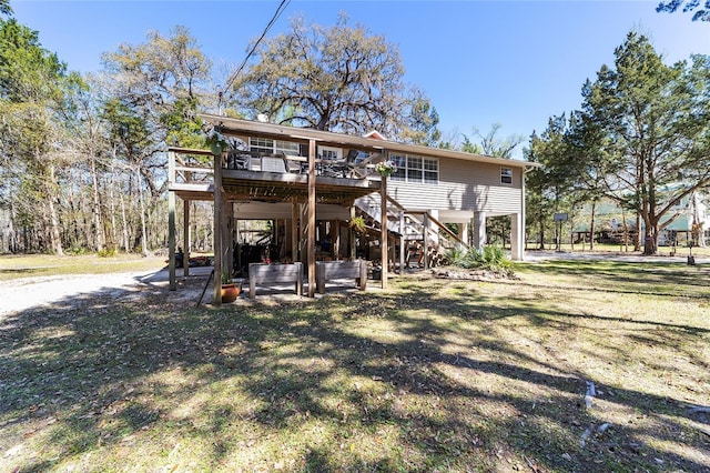 back of property with stairway and a wooden deck