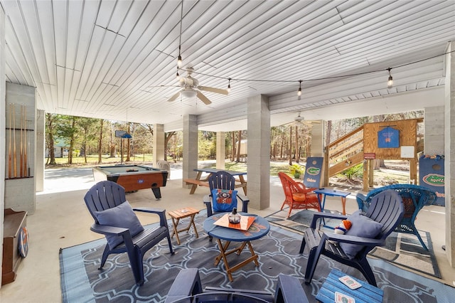 view of patio with ceiling fan and a hot tub