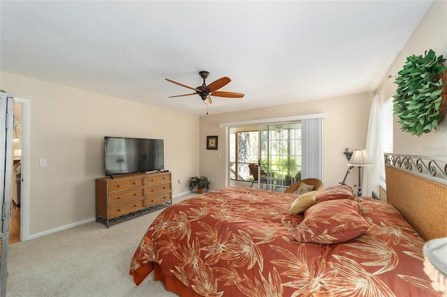 carpeted bedroom featuring access to exterior, baseboards, and ceiling fan