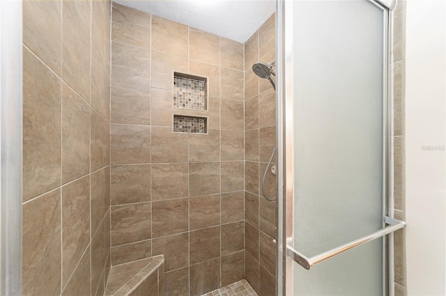 full bathroom with a shower stall