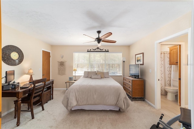 bedroom featuring ceiling fan, baseboards, and light carpet