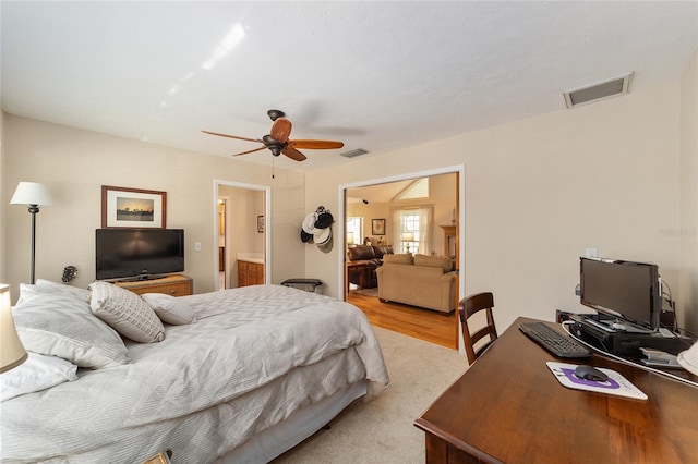 bedroom with a ceiling fan and visible vents