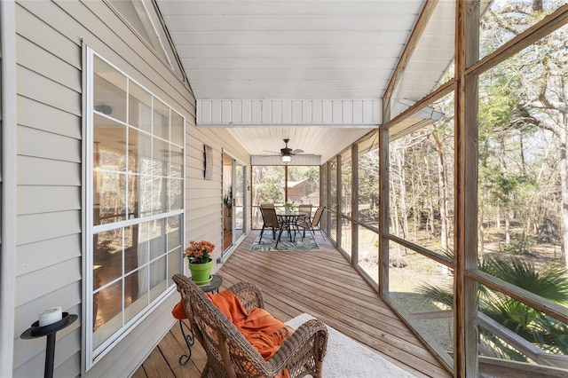 unfurnished sunroom featuring lofted ceiling