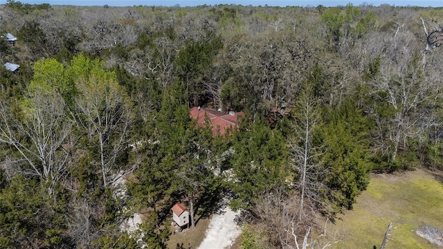 birds eye view of property with a forest view