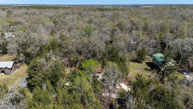 birds eye view of property with a view of trees