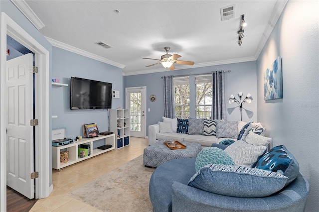 living area with tile patterned flooring, crown molding, and visible vents