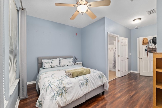 bedroom featuring visible vents, baseboards, and wood finished floors