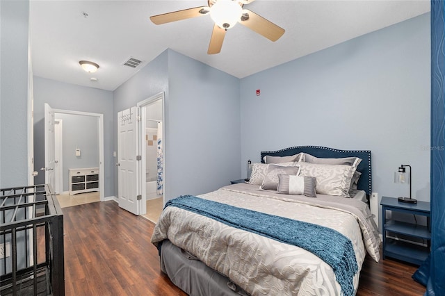 bedroom featuring visible vents, baseboards, a ceiling fan, and wood finished floors