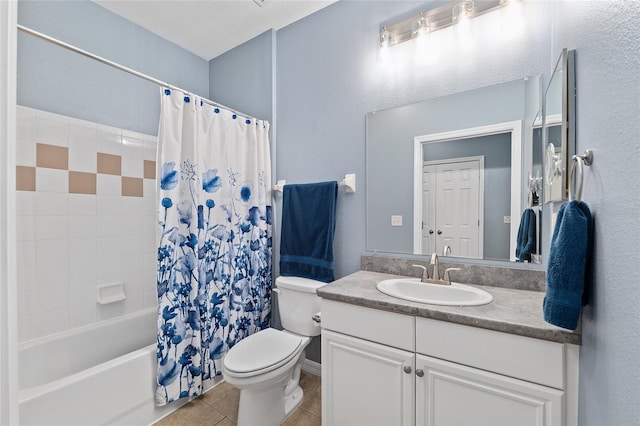 full bathroom featuring tile patterned floors, shower / bath combination with curtain, toilet, and vanity