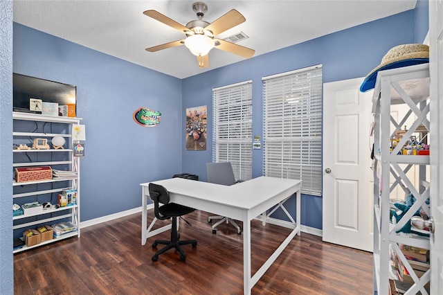 office area featuring ceiling fan, wood finished floors, visible vents, and baseboards