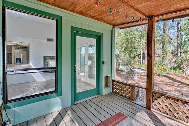 sunroom with wood ceiling