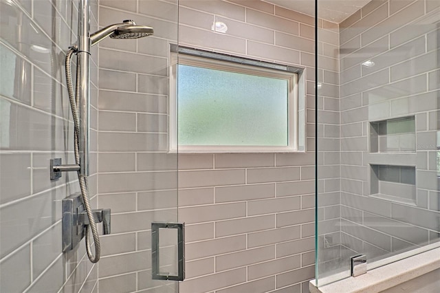 full bathroom with tiled shower