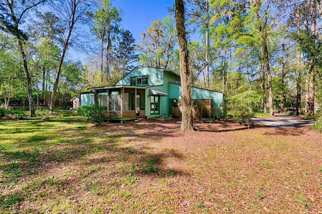 view of yard featuring a sunroom