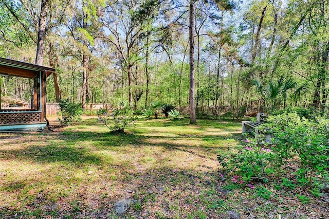 view of yard with a wooded view