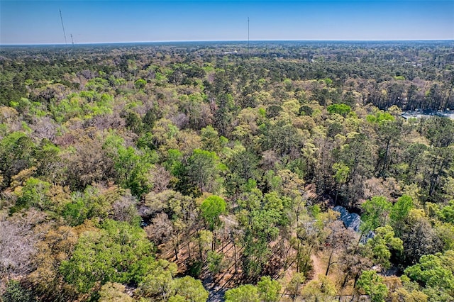 aerial view featuring a wooded view