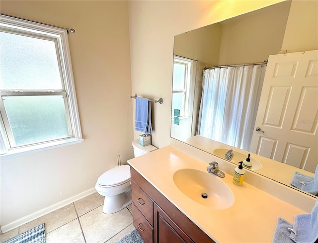 full bathroom with tile patterned floors, a shower with curtain, toilet, baseboards, and vanity