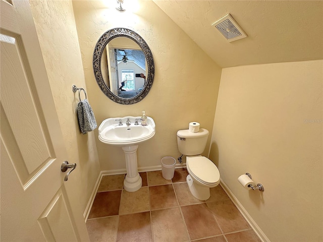 bathroom featuring tile patterned flooring, visible vents, toilet, and baseboards