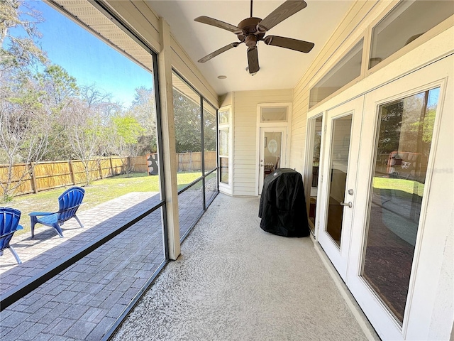 sunroom with a ceiling fan