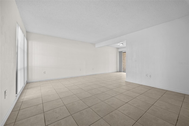 empty room featuring a textured ceiling