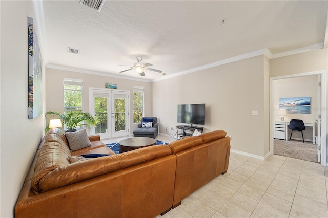 living area featuring visible vents, crown molding, and french doors