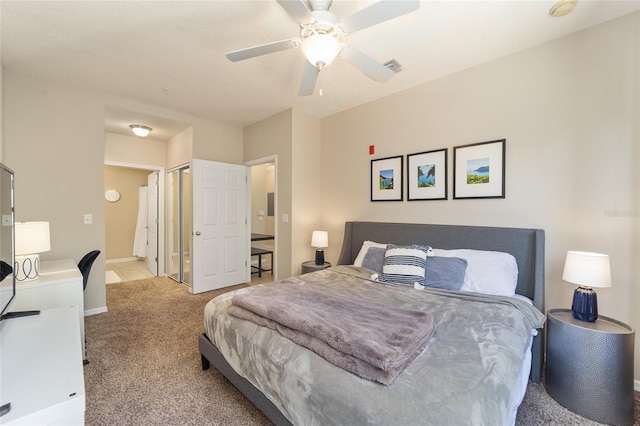 bedroom with visible vents, baseboards, carpet flooring, a closet, and a ceiling fan