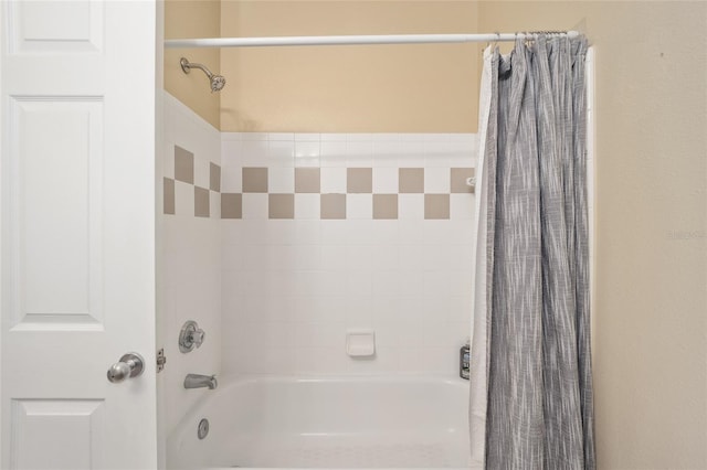 bathroom featuring shower / bath combo with shower curtain