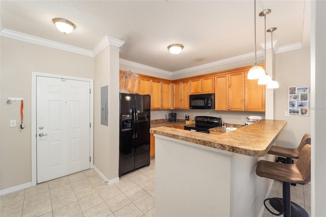 kitchen featuring light tile patterned floors, black appliances, a peninsula, and ornamental molding