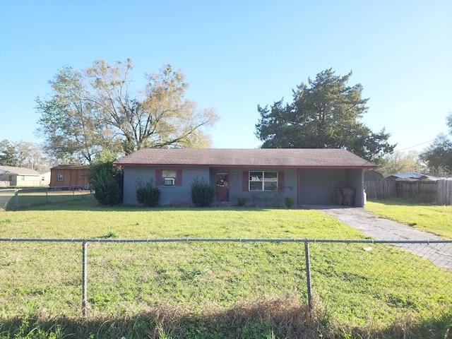 ranch-style house with an attached carport, a front lawn, fence private yard, and driveway