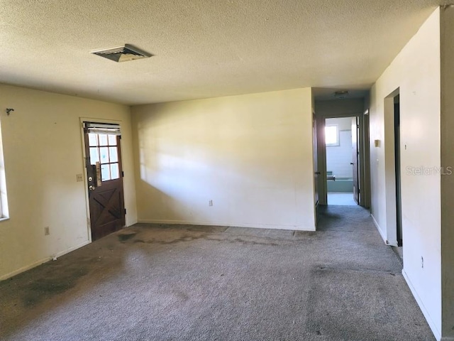 interior space with visible vents and a textured ceiling