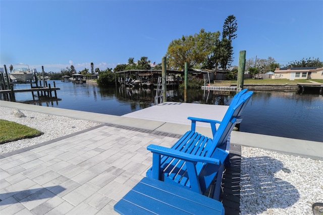 dock area with a water view and boat lift