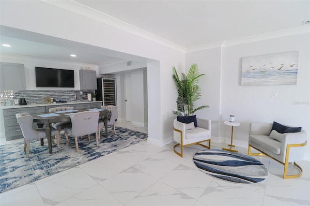 dining area featuring baseboards, visible vents, recessed lighting, crown molding, and marble finish floor