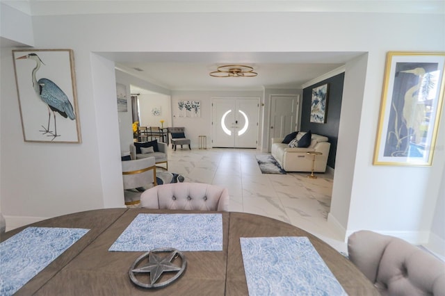 dining space featuring marble finish floor