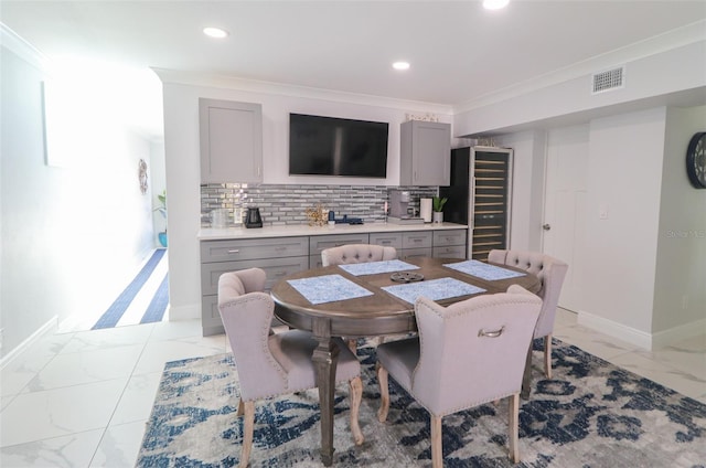 dining room with baseboards, visible vents, recessed lighting, ornamental molding, and marble finish floor