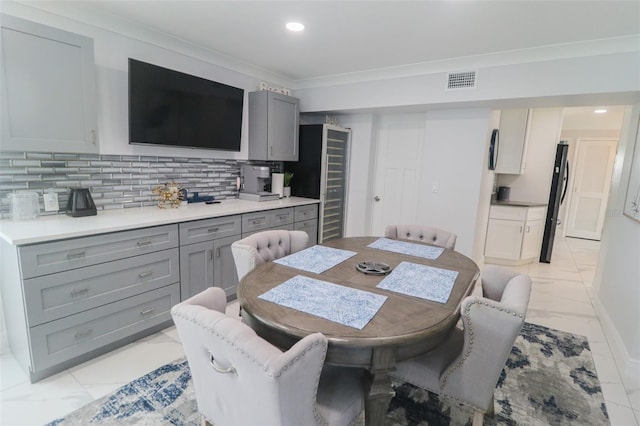 dining area with baseboards, visible vents, recessed lighting, ornamental molding, and marble finish floor