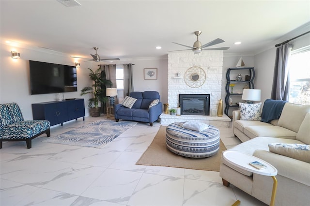 living area featuring crown molding, marble finish floor, and ceiling fan