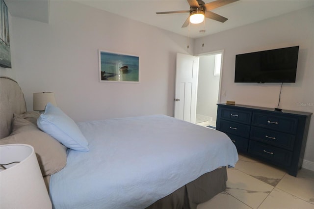 bedroom with marble finish floor and ceiling fan